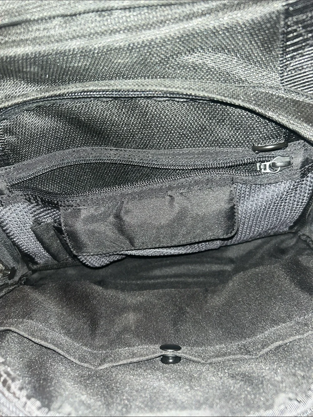 Tumi Black Duffel Bag with Red Logo Accent